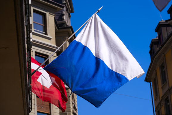 Old town of Lucerne with Swiss flag and flag of City and Canton Lucerne on a sunny spring day.